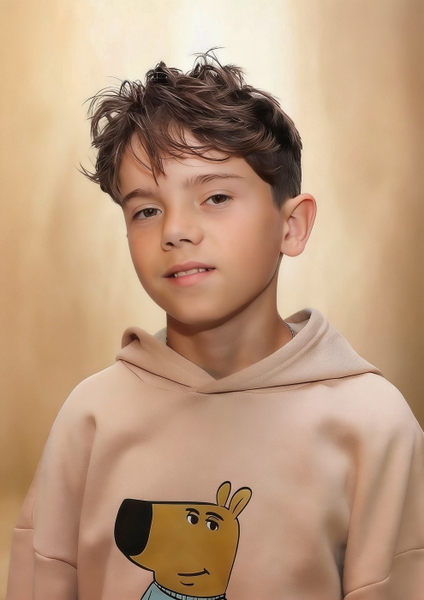 Studio portrait of a boy in a beige hoodie with a cartoon dog on it — watermark removed by GoStudio Advanced