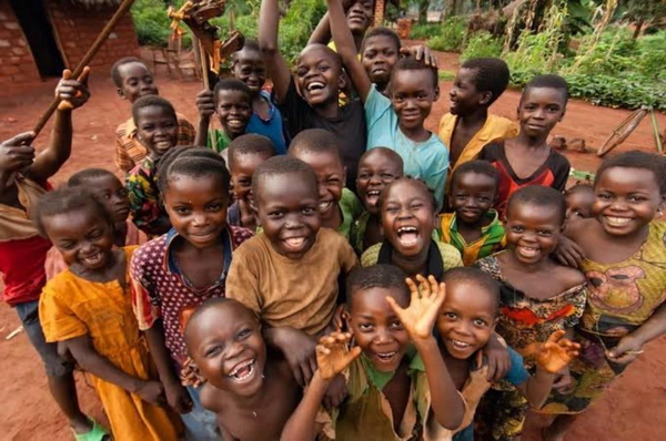 Crowd of laughing children waving at the camera — watermark removed by GoStudio Lite