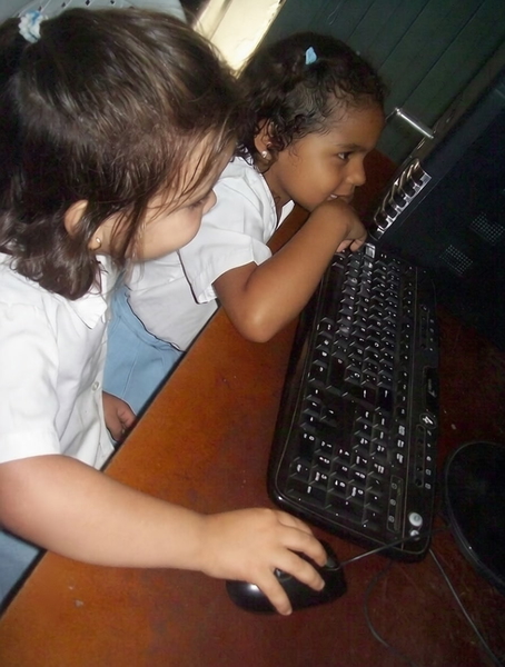 Two small children at a computer keyboard — watermark removed by GoStudio Pro