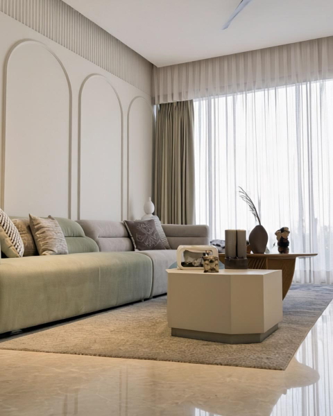 Living room with arched wall panels, a pale green sofa and sheer curtains — watermark removed by GoStudio Lite