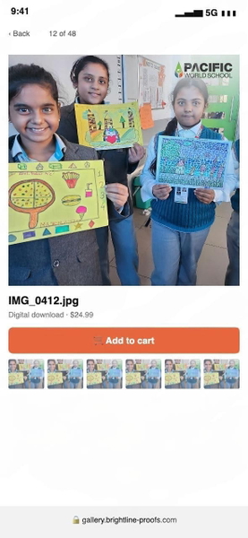 Phone screenshot of a photo gallery showing three schoolchildren holding drawings — watermark removed by GoStudio Lite