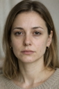 Sample portrait of a woman with freckles to try in the AI face retouch tool