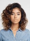 A woman in a denim shirt with a wavy bob, a sample portrait to try in the AI makeup studio.