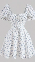 A flat-lay photo of a white dress with blue floral print, puff sleeves, and a v-neckline, laid out for AI virtual try-on.