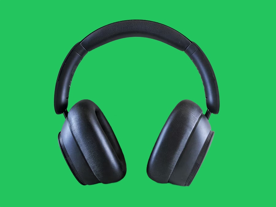 Black over-ear headphones on a green background after AI background removal Black over-ear headphones on a green background after AI background removal