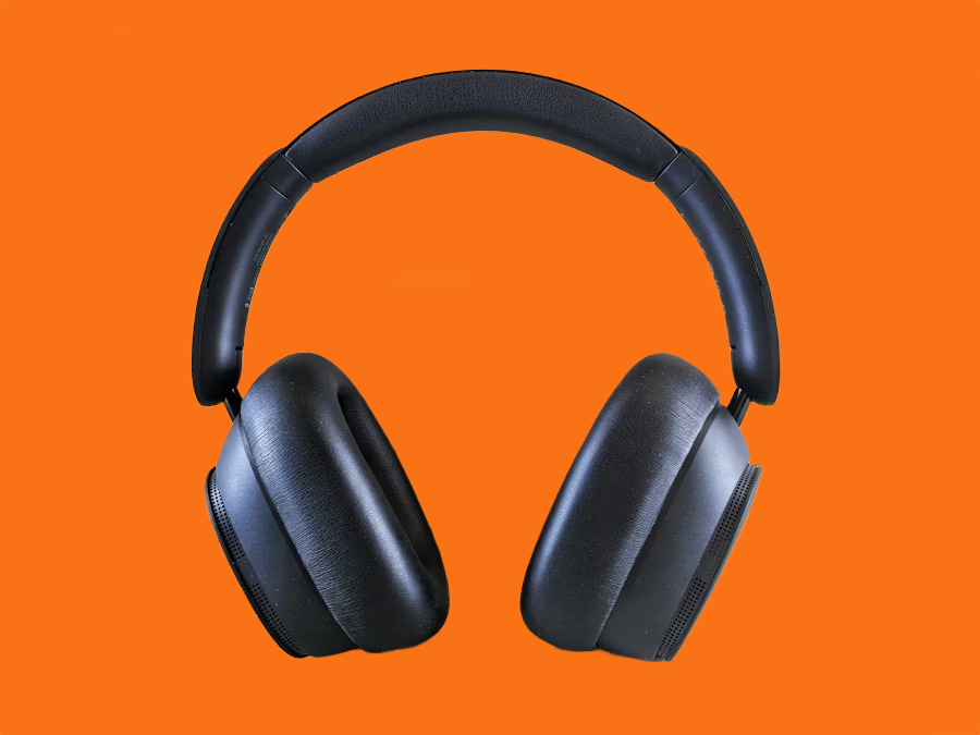 Black over-ear headphones on a orange background after AI background removal