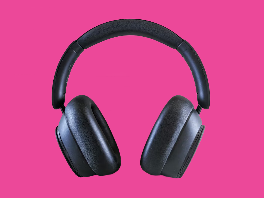 Black over-ear headphones on a pink background after AI background removal Black over-ear headphones on a pink background after AI background removal