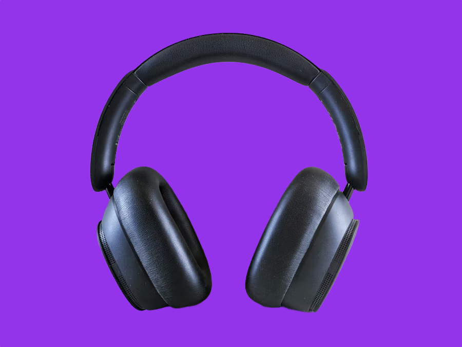 Black over-ear headphones on a purple background after AI background removal