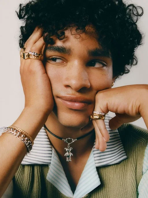 Young man wearing two rings, a chain bracelet and a pendant necklace, before AI jewelry removal Young man wearing two rings, a chain bracelet and a pendant necklace, before AI jewelry removal