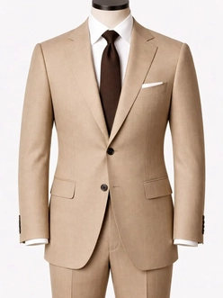A tan suit with a white shirt and brown tie on a tailor’s mannequin — a garment photo for the AI clothes changer