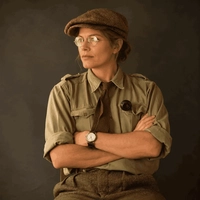 Sample vintage portrait of a woman in a tweed cap and round wire spectacles, try removing glasses from an old photo