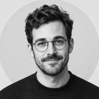 Sample black-and-white profile photo of a man in round wire glasses, try removing glasses from a profile picture