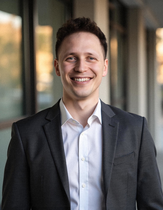 Professional AI-generated headshot showing a person in business attire